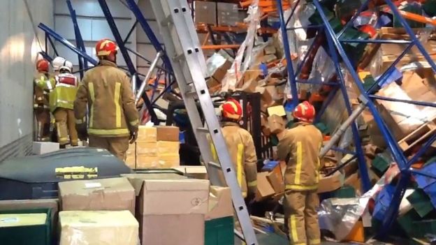 Forklift driver burried under tons of cheese