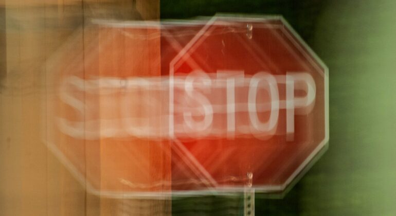 A,Blurry,Stop,Sign,Seen,Through,Impaired,Vision,Or,Distorted